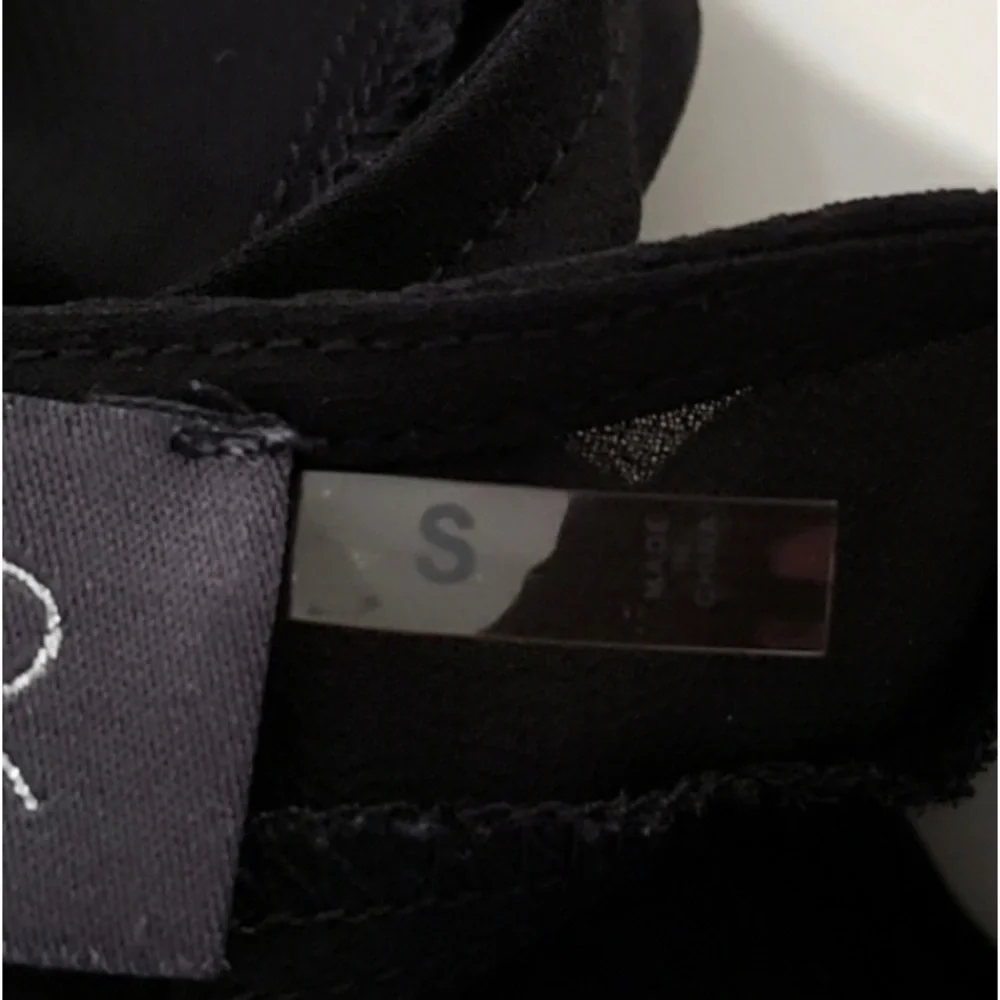 ASTR The Label Black Sleeveless Sheer Floral Top
Size: S - Picture 8 of 11
